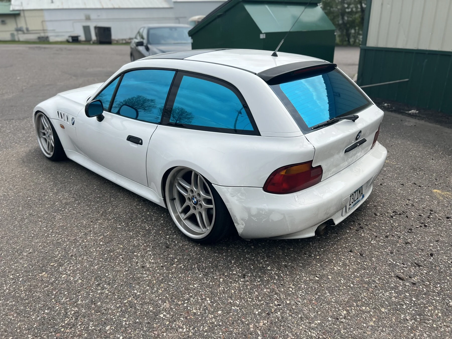 White wagon with blue-tinted side and rear glass