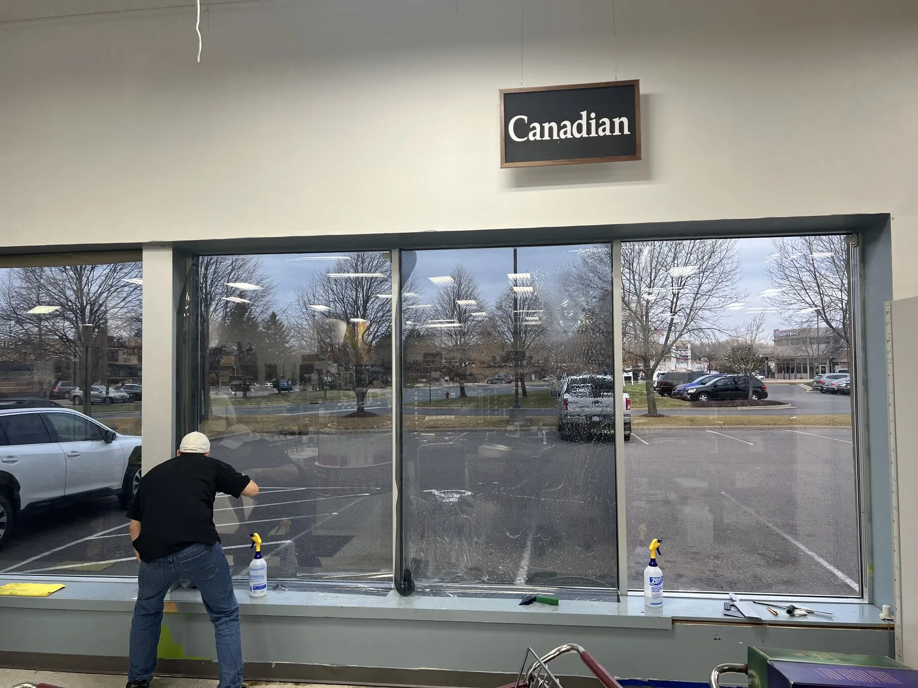 Installer working on large commercial windows
